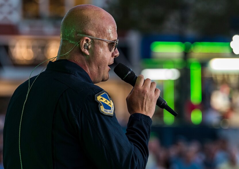 Senior Master Sgt. Ryan Carson, Max Impact superintendent and vocalist, works up a sweat during a performance June 16, 2018, at Rehoboth Beach, Del. Hundreds of beachgoers watched Max Impact perform for more than an hour during the Rehoboth Beach Bandstand Summer Concert Series. Max Impact, the premier rock band of the U.S. Air Force, is stationed at Joint Base Anacostia-Bolling in Washington, D.C. (U.S. Air Force photo by Roland Balik)