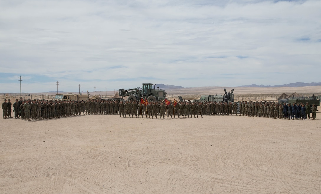 Marines with Combat Logistics Battalion 25, Combat Logistics Regiment 45, 4th Marine Logistics Group, pose for a group photo during Integrated Training Exercise 4-18 at Marine Corps Air Ground Combat Center Twentynine Palms, Calif., June 12, 2018. ITX 4-18 provides Marine Air Ground Task Force elements an opportunity to undergo a service-level assessment of core competencies that are essential to expeditionary, forward-deployed operations. (U.S. Marine Corps photo by Lance Cpl. Samantha Schwoch/released)