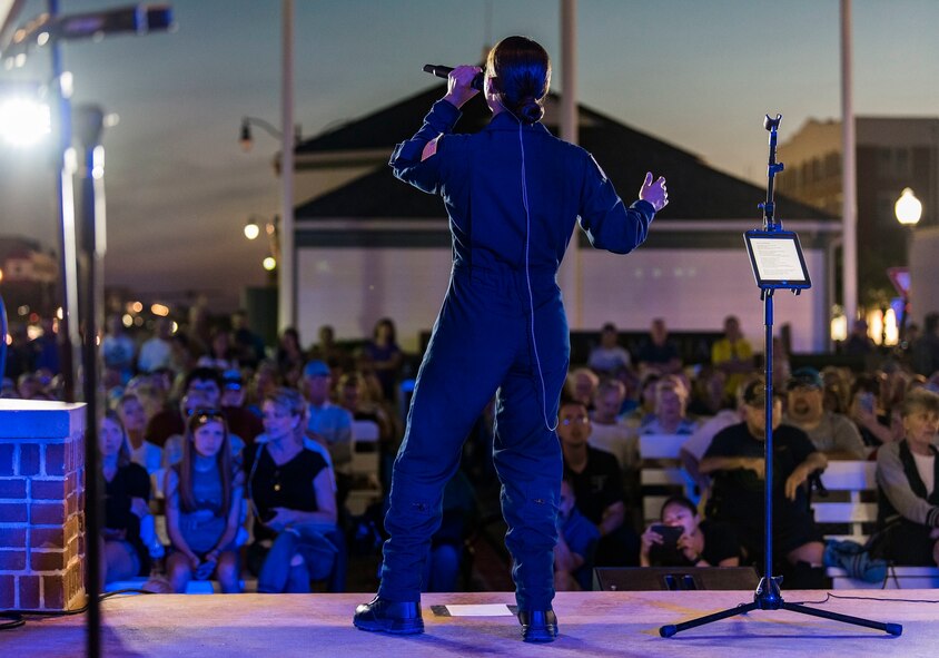 Tech. Sgt. Nalani Quintello, Max Impact vocalist, performs for hundreds of beachgoers June 16, 2018, on the bandstand at the Rehoboth Beach, Del. Quintello was a former contestant on the television show, “American Idol;” she withdrew from the competition to serve in the Air Force. Max Impact, the premier rock band of the U.S. Air Force, is stationed at Joint Base Anacostia-Bolling in Washington, D.C. (U.S. Air Force photo by Roland Balik)