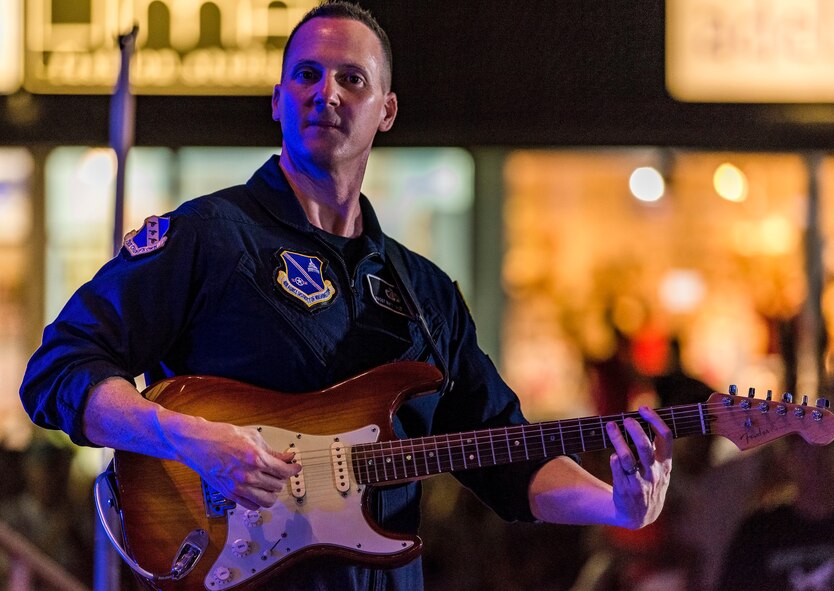 Senior Master Sgt. Matthew Ascione, Max Impact guitarist, plays the electric guitar June 16, 2018, on the bandstand at Rehoboth Beach, Del. Ascione has the additional duty as the section chief of Outreach and Media Relations for the organization. Max Impact, the premier rock band of the U.S. Air Force, is stationed at Joint Base Anacostia-Bolling in Washington, D.C. (U.S. Air Force photo by Roland Balik)