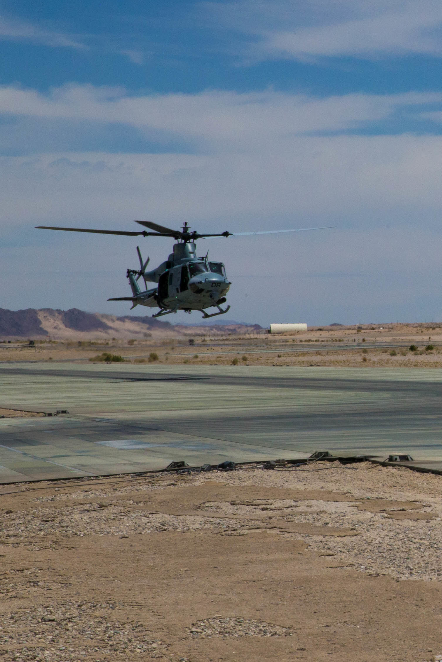 A UH-1Y Venom with Marine Light Helicopter Attack Squadron 775, Marine Aircraft Group 41, 4th Marine Aircraft Wing, taxis onto the airfield after a gun shoot, during Integrated Training Exercise 4-18, at Marine Corps Air Ground Combat Center Twentynine Palms, Calif., June 16, 2018. MAG 41, comprised of fixed wing tactical aircraft, tilt-rotor aircraft and rotary-wing assault support aircraft, provide the Aviation Combat Element to Marine Air Ground Task Force 23 during ITX 4-18. (U.S. Marine Corps photo by Lance Cpl. Samantha Schwoch/released)