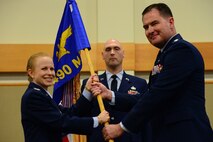 Lt. Col. Troy Stauter, right, accepts command of the 490th Missile Squadron from Col. Anita Feugate Opperman, 341st Operations Group commander, during an assumption of command ceremony June 20, 2018, at the Grizzly Bend at Malmstrom AFB, Mont.