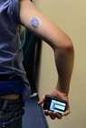Ziggy Richards poses for a photo to display his insulin pump May 23, 2018, at Malmstrom Air Force Base, Mont.