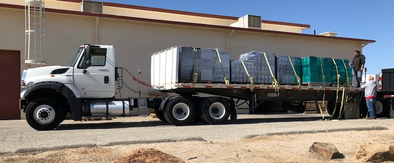 A truckload of computers is prepared at Edwards Air Force Base, California for delivery to a local school. The donation was possible because of an educational partnership agreement between the Air Force Test Center and the school district. (Courtesy photo)