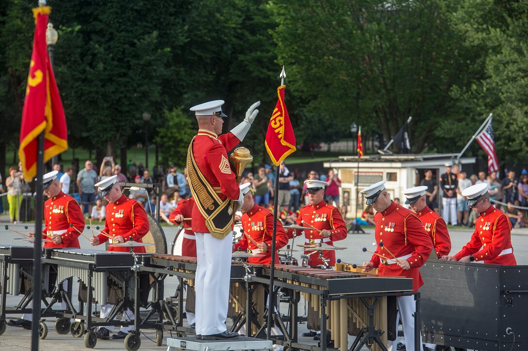 Master Sgt. Keith Martinez, assistant drum major, “The Commandant’s Own” U.S. Marine Drum & Bugle Corps conducts the D&B during a Tuesday Sunset Parade at the Lincoln Memorial, Washington D.C., June 19, 2018. The guest of honor for the parade was Vice Adm. Octavio Trejo Hermida, Mexico Naval Attaché, and the hosting official was Brig. Gen. Dmitri Henry, director of intelligence.(Official U.S. Marine Corps photo by Sgt. Robert Knapp/Released)