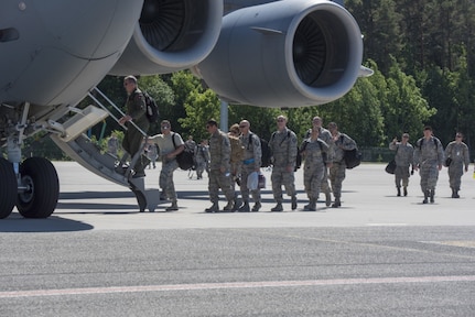 U.S. Air Force Airmen, assigned to the 140th Wing, Colorado Air National Guard, board a C-17 Globemaster III from Papa Air Base traveling to Slovenia to support the Adriatic Strike 2018 exercise at Amari Air Base, Estonia, June 3, 2018.