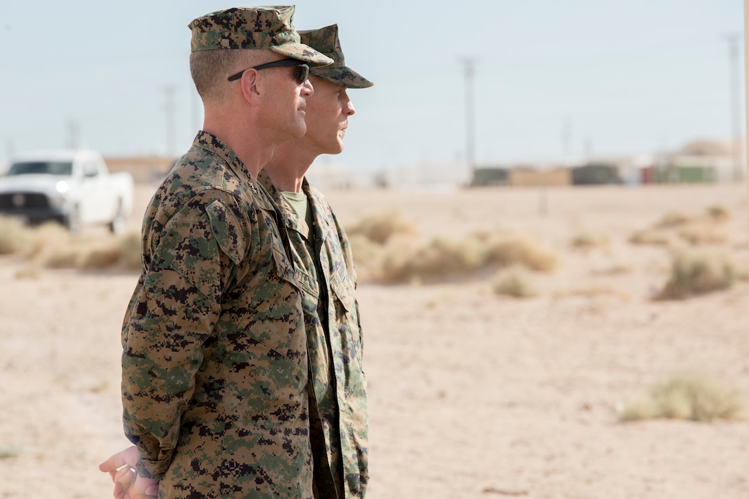 Maj. Gen. Burke Whitman (left), commanding general of 4th Marine Division, and Col. Steven White (right), commanding officer of 23rd Marine Regiment, 4th MARDIV, observe unit leaders discuss tactics and maneuvers for the final exercise of 1st Battalion, 23rd Marines, 4th MARDIV, during Integrated Training Exercise 4-18, aboard Marine Corps Air Ground Combat Center Twentynine Palms, Calif., June 15, 2018. ITX 4-18 provides Marine Air-Ground Task Force elements an opportunity to undergo service-level competency assessments so that they can seamlessly integrate with active duty Marines in the event of a crises that requires a rapid response. (U.S. Marine Corps photo by Cpl. Dallas Johnson/Released)
