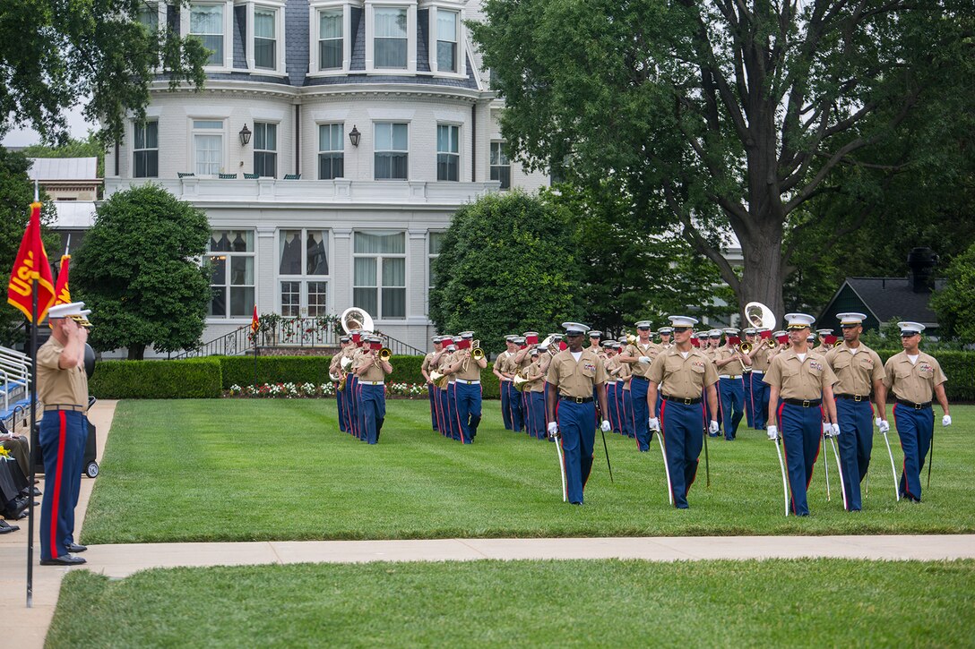 Marines with the Marine Barracks Washington D.C. parade marching staff execute “eyes right” during a change of command ceremony at the Barracks, June 20, 2018. Colonel Tyler J. Zagurski relinquished his command of Marine Barracks Washington D.C. to Col. Don Tomich. Tomich previously served as the Assistant Chief of Staff for Operations, Marine Forces Central Command. (Official Marine Corps photo by Sgt. Robert Knapp/Released)