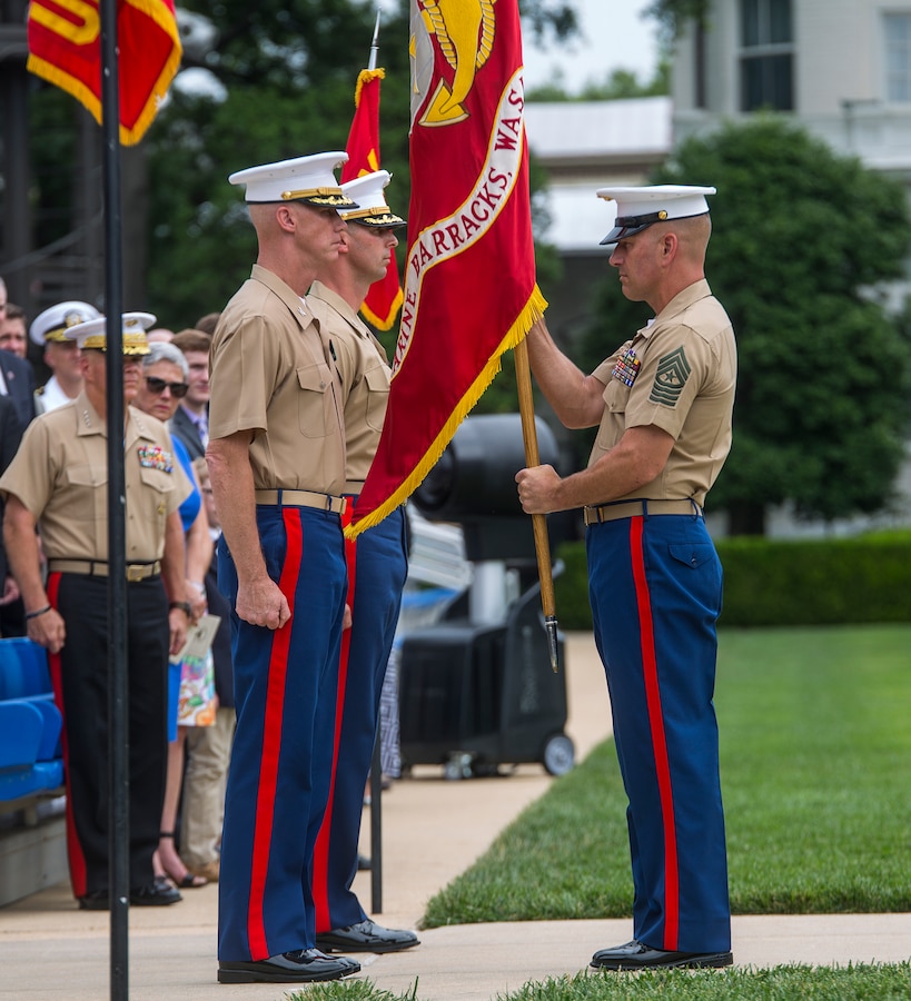 Sergeant Maj. Matthew Hackett, right, command sergeant major, Marine Barracks Washington D.C., prepares to pass off the Marine Corps Battle Colors to Col. Tyler J Zagurski, outgoing commanding officer, Marine Barracks Washington D.C., during a change of command ceremony at the Barracks, June 20, 2018. Colonel Tyler J. Zagurski relinquished his command of Marine Barracks Washington D.C. to Col. Don Tomich. Tomich previously served as the Assistant Chief of Staff for Operations, Marine Forces Central Command. (Official Marine Corps photo by Sgt. Robert Knapp/Released)
