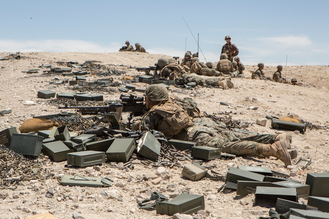 Reserve Marines with Company A, 1st Battalion, 23rd Marine Regiment, 4th Marine Division, fire their M240 and M2 .50 caliber machine guns during an air assault course at Integrated Training Exercise 4-18, aboard Marine Corps Air Ground Combat Center Twentynine Palms, Calif., June 16, 2018. ITX 4-18 provides Marine Air-Ground Task Force elements an opportunity to undergo service-level competency assessments so that they can seamlessly integrate with active duty Marines in the event of a crises that requires a rapid response. (U.S. Marine Corps photo by Cpl. Dallas Johnson/Released)