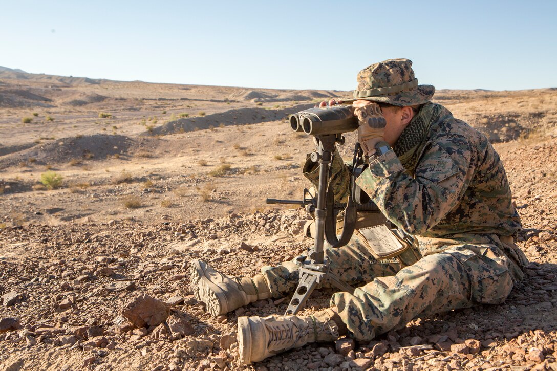 Lance Cpl. Benjamin Strube, a scout observer with Battery M, 3rd Battalion, 14th Marine Regiment, 4th Marine Division, calibrates a vector during an air assault course for Company A, 1st Battalion, 23rd Marine Regiment, 4th MARDIV, during Integrated Training Exercise 4-18, aboard Marine Corps Air Ground Combat Center Twentynine Palms, Calif., June 17, 2018. ITX 4-18 provides Marine Air-Ground Task Force elements an opportunity to undergo service-level competency assessments so that they can seamlessly integrate with active duty Marines in the event of a crises that requires a rapid response. (U.S. Marine Corps photo by Cpl. Dallas Johnson/Released)