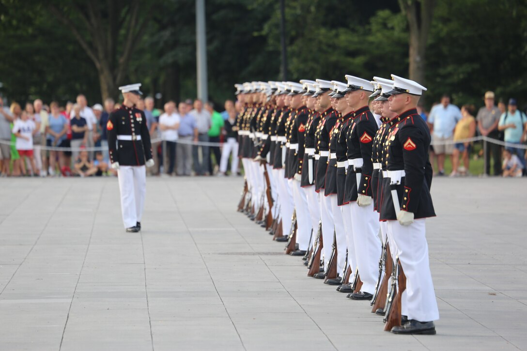 Corporal Ryan Watkins, rifle inspector, U.S. Marine Corps Silent Drill Platoon, prepares to execute a rifle inspection during the Tuesday Sunset Parade at the Lincoln Memorial, Washington, D.C., June 19, 2018. The guest of honor for the parade was Vice Adm. Ocatavio Trejo Hermida, Mexico Naval Attaché, and the hosting official was Brig. Gen. Dimtri Henry, director of Intelligence.