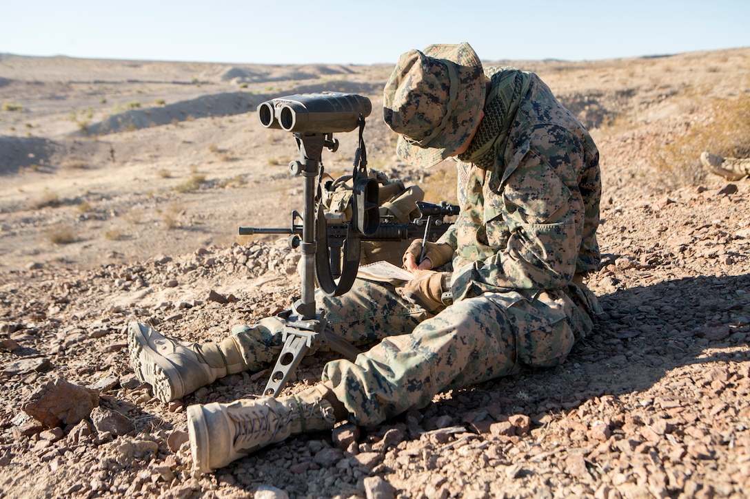 Lance Cpl. Benjamin Strube, a scout observer with Mike Battery, 3rd Battalion, 14th Marine Regiment, 4th Marine Division, sketches distant mountainous terrain during an air assault course for Alpha Company, 1st Battalion, 23rd Marine Regiment, 4th MARDIV, during Integrated Training Exercise 4-18, aboard Marine Corps Air Ground Combat Center Twentynine Palms, Calif., June 17, 2018. ITX 4-18 provides Marine Air-Ground Task Force elements an opportunity to undergo service-level competency assessments so that they can seamlessly integrate with active duty Marines in the event of a crises that requires a rapid response. (U.S. Marine Corps photo by Cpl. Dallas Johnson/Released)