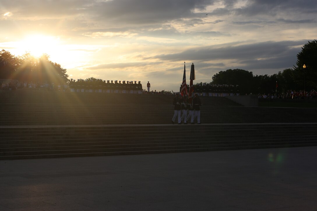 Marines with the U.S. Marine Corps Color Guard march the National Ensign and the U.S. Marine Corps Battle Colors off the parade deck during the Sunset Parade at the Lincoln Memorial, Washington D.C., June 19, 2018. The guest of honor for the parade was Vice Adm. Ocatavio Trejo Hermida, Mexico Naval Attaché, and the hosting official was Brig. Gen. Dimtri Henry, director of intelligence.