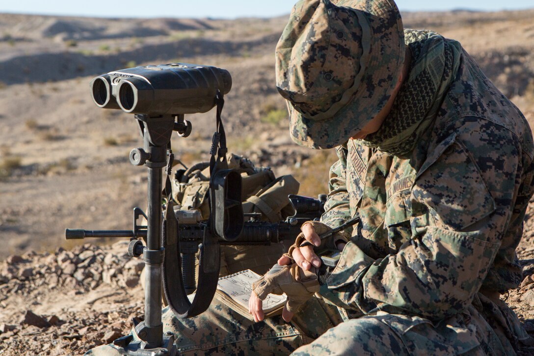 Lance Cpl. Benjamin Strube, a scout observer with Battery M, 3rd Battalion, 14th Marine Regiment, 4th Marine Division, sketches distant mountainous during an air assault course for Company A, 1st Battalion, 23rd Marine Regiment, 4th MARDIV, during Integrated Training Exercise 4-18, aboard Marine Corps Air Ground Combat Center Twentynine Palms, Calif., June 17, 2018. ITX 4-18 provides Marine Air-Ground Task Force elements an opportunity to undergo service-level competency assessments so that they can seamlessly integrate with active duty Marines in the event of a crises that requires a rapid response. (U.S. Marine Corps photo by Cpl. Dallas Johnson/Released)