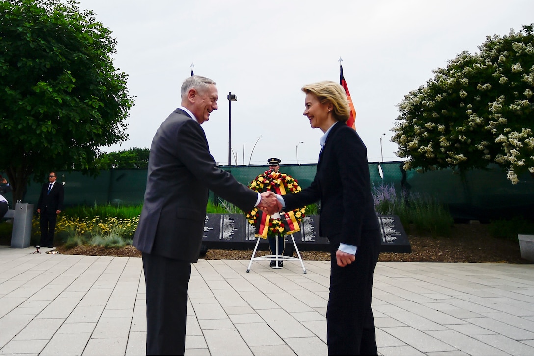 Defense Secretary James N. Mattis shakes hands with his German counterpart near a wreath outside the Pentagon.