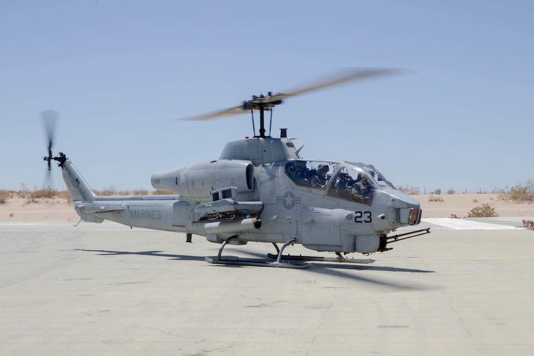 An AH-1W SuperCobra, belonging to Marine Light Attack Helicopter Squadron 775, Marine Aircraft Group 41, 4th Marine Aircraft Wing, waits at the arm/de-arm station before conducting a close air support mission, during Integrated Training Exercise 4-18 at Marine Corps Air Ground Combat Center Twentynine Palms, Calif., June 18, 2018. HMLA-775, also known as the “Coyotes”, provided air combat element support to Marine Air Ground Task Force 23 during ITX 4-18. (U.S. Marine Corps photo by Lance Cpl. Samantha Schwoch/released)