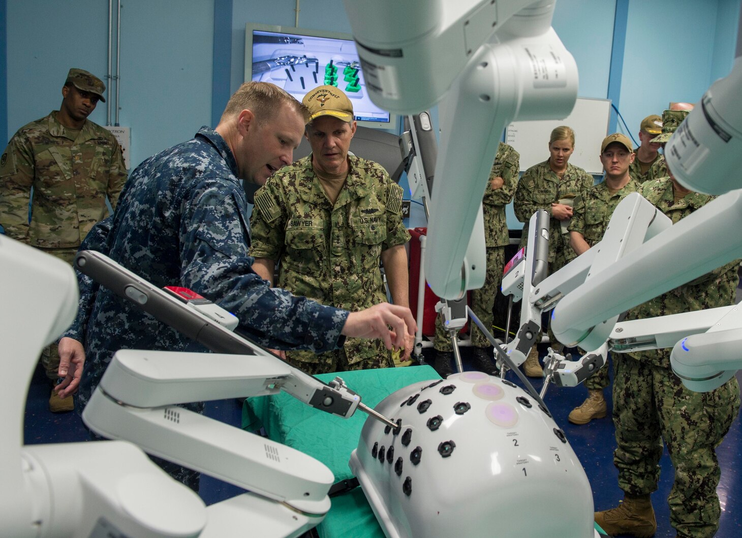 Vice Adm. Phillip Sawyer (center), commander, U.S. 7th Fleet, views the Da Vinci Robotic Surgical System aboard Military Sealift Command hospital ship USNS Mercy (T-AH 19) during a tour of the ship. Mercy is making port visits to Yokosuka and Tokyo to promote relationships between U.S. Navy Sailors and Japanese citizens through cultural exchange and bilateral training.