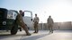 Aerial porters from the 442nd Air Expeditionary Squadron prepare to leave the flightline after a 12-hour shift, June 6, 2018, at Camp Taji, Iraq.