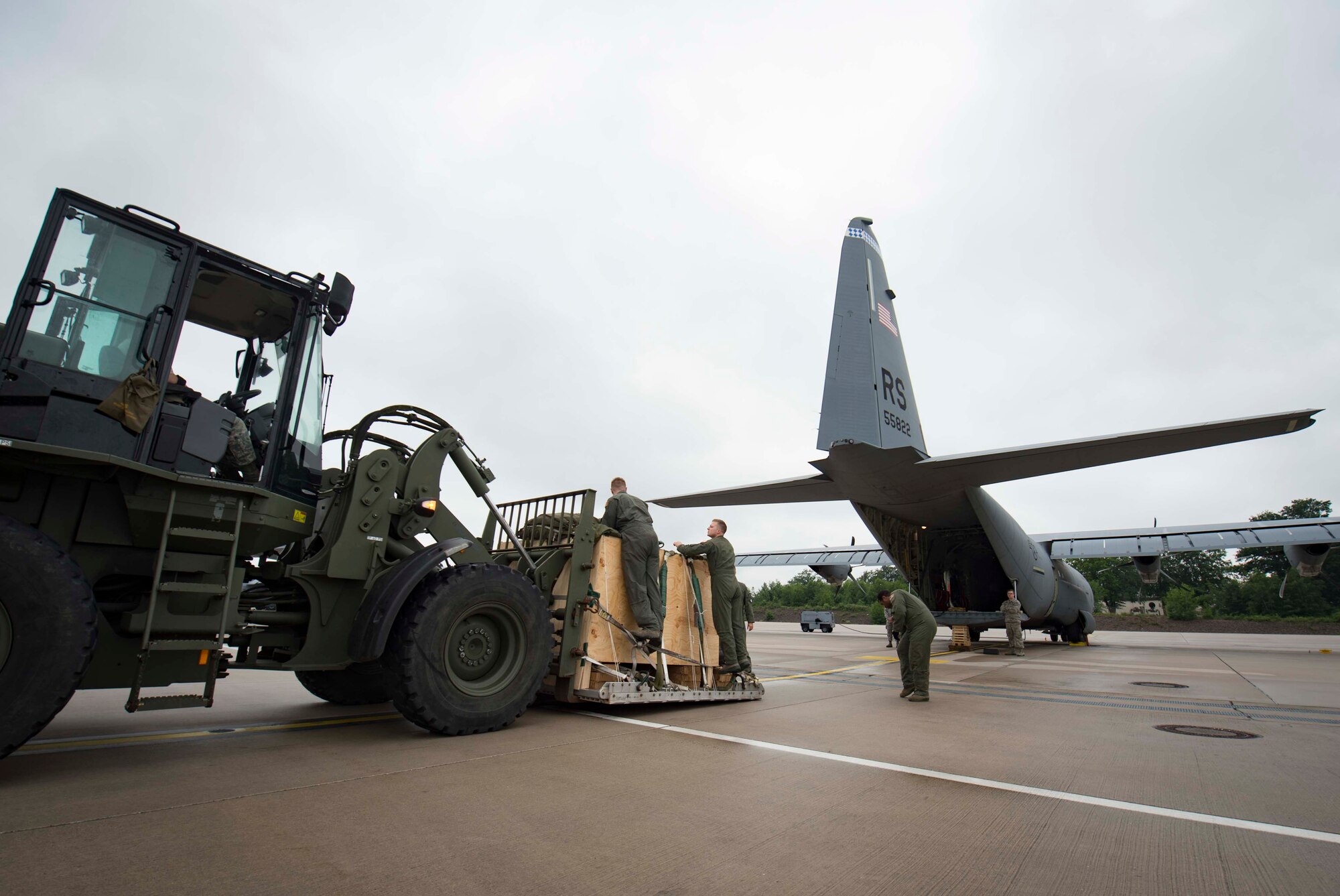 Loadmasters assigned to the 37th Airlift Squadron inspect cargo to be loaded onto a C-130J Super Hercules aircraft on Ramstein Air Base, Germany, June 12, 2018. Ramstein's loadmasters calculate the center of gravity on the aircraft and arrange cargo by weight to ensure the aircraft remains properly balanced even after adding up to 41,790 pounds. (U.S. Air Force photo by Senior Airman Elizabeth Baker)