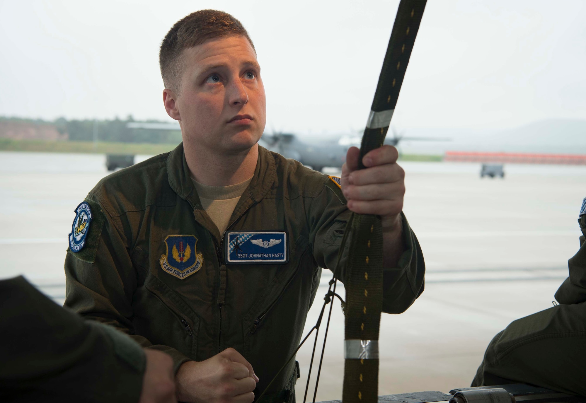 U.S. Air Force Staff Sgt. Johnathan Hasty, 37th Airlift Squadron C-130J Super Hercules aircraft loadmaster, secures a payload on a C-130J on Ramstein Air Base, Germany, June 12, 2018. Ramstein's loadmasters regularly participate in practice aerial deliveries to ensure that when they need to deliver cargo such as food and water for real-world missions, they make no mistakes. (U.S. Air Force photo by Senior Airman Elizabeth Baker)