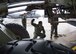 U.S. Air Force Airman 1st Class Jonathan Zapata, center, 37th Airlift Squadron C-130J Super Hercules aircraft loadmaster, directs a forklift operator loading cargo into a C-130J on Ramstein Air Base, Germany, June 12, 2018. Ramstein's loadmasters are skilled in loading and securing cargo such as vehicles and personnel inside a C-130J. (U.S. Air Force photo by Senior Airman Elizabeth Baker)