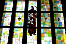 Stained glass adorns the window of the Southside Chapel on Ramstein Air Base, Germany, April 19, 2018. The 86th Airlift Wing Chaplain Corps aims to meet the spiritual needs of Airmen and their families in the Kaiserslautern Military Community. (U.S. Air Force photo by Senior Airman Joshua Magbanua)
