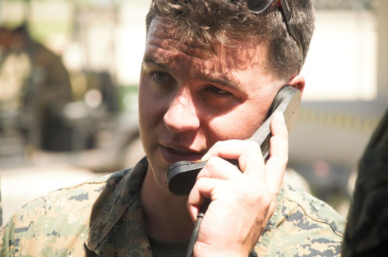 U.S. Marine Cpl. Tyler Slaggert, a field radio operator with Special Purpose Marine Air-Ground Task Force - Southern Command, performs radio checks with soldiers from Joint Task Force - Bravo's 1st Battalion, 228th Aviation Regiment during a communications exercise aboard Soto Cano Air Base, Honduras, to prepare for future joint-level operations, June 19, 2018. The Marines and sailors of SPMAGTF-SC are conducting security cooperation training and engineering projects alongside partner nation military forces in Central and South America. The unit is also on standby to provide humanitarian assistance and disaster relief in the event of a hurricane or other emergency in the region.