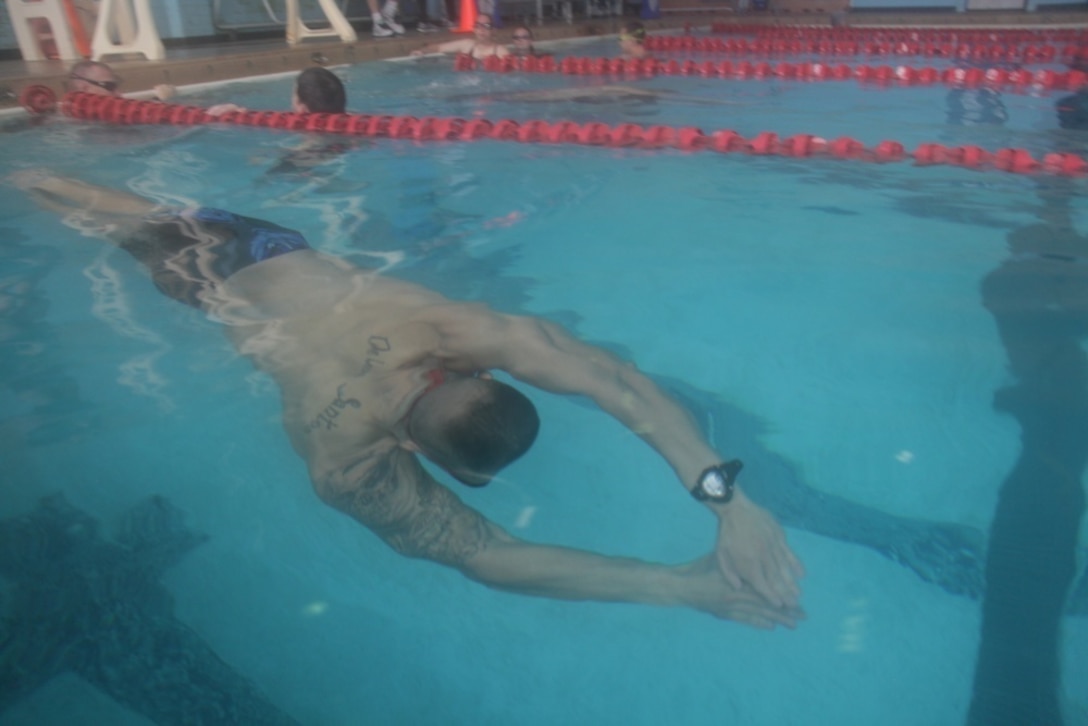 A soldier swims during training.