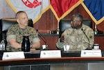 DLA Director Army Lt. Gen. Darrell Williams (right) describes the strong U.S. Marine Corps and the Defense Logistics Agency  partnership to Marine Corps Lt. Gen. Mike Dana (left), deputy commandant of installations and logistics, and other officials during the annual Marine Corps-DLA Day at the McNamara Headquarters Complex June 13. Photo by Teodora Mocanu