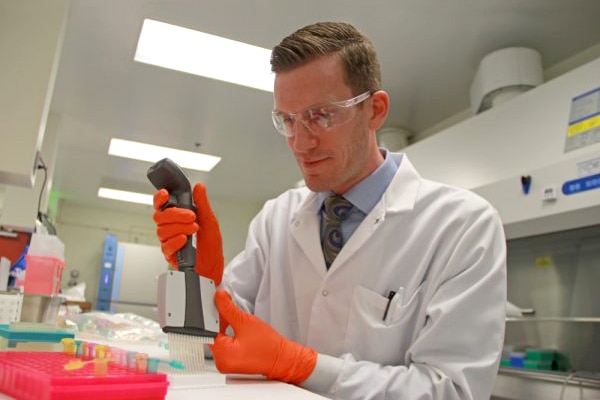 A researcher works in a lab.