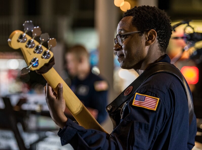 Tech. Sgt. Victor Holmes Jr., fill-in double bassist from the U.S. Air Force Concert Band, performs with Max Impact June 16, 2018, on the bandstand at Rehoboth Beach, Del. Holmes has the additional duty as an anti-terrorism representative as well as a physical training leader for the Concert Band. Max Impact, the premier rock band of the U.S. Air Force, is stationed at Joint Base Anacostia-Bolling in Washington, D.C. (U.S. Air Force photo by Roland Balik)