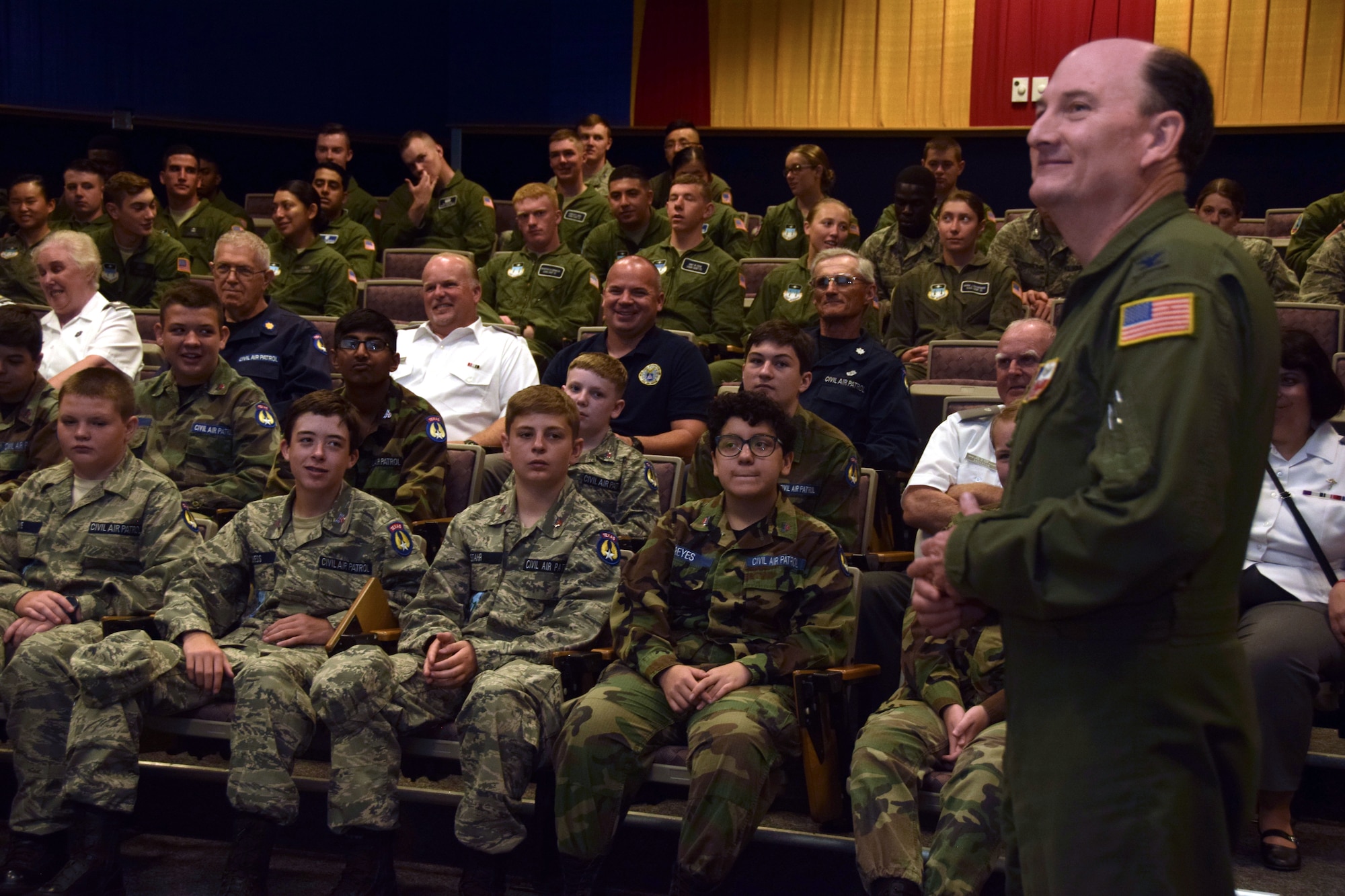 Col. Thomas K. Smith Jr., 433rd Airlift Wing commander, describes the Alamo Wing's mission to cadets of the Air Force Academy and Civil Air Patrol at Joint Base San Antonio-Lackland, Texas, June 8, 2018. The cadets and their chaperones caught a flight onboard a C-5M Super Galaxy aircraft, which is used to provide airlift support for peacetime, contingency and humanitarian operations. (U.S. Air Force photo by Staff Sgt. Lauren M. Snyder)