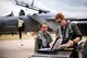 A 493rd Fighter Squadron pilot explains his normal routines with U.S. Air Force Academy cadet Christen Dahl prior to her familiarization flight at Royal Air Force Lakenheath, England, June 13. The Six U.S. Air Force Academy cadets were imbedded in the 48th Fighter Wing as part of “Operation Air Force,” as a way to get a feel of active duty life. (U.S. Air Force photo/ Senior Airman Malcolm Mayfield)
