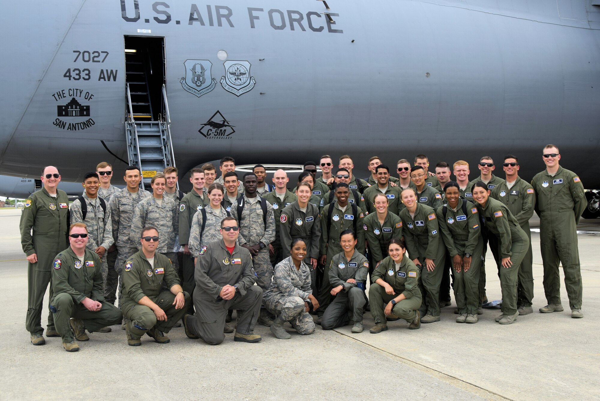 U.S. Air Force Academy cadets pose with Col. Thomas K. Smith Jr. (far left), 433rd Airlift Wing commander, and the Reserve Citizen Airmen aircrew of the C-5M Super Galaxy aircraft after an incentive flight from Joint Base San Antonio-Lackland, Texas, June 8, 2018. With the C-5M, the Alamo Wing provides massive strategic airlift for deployment and supply of combat and support forces worldwide. (U.S. Air Force photo by Staff Sgt. Lauren M. Snyder)
