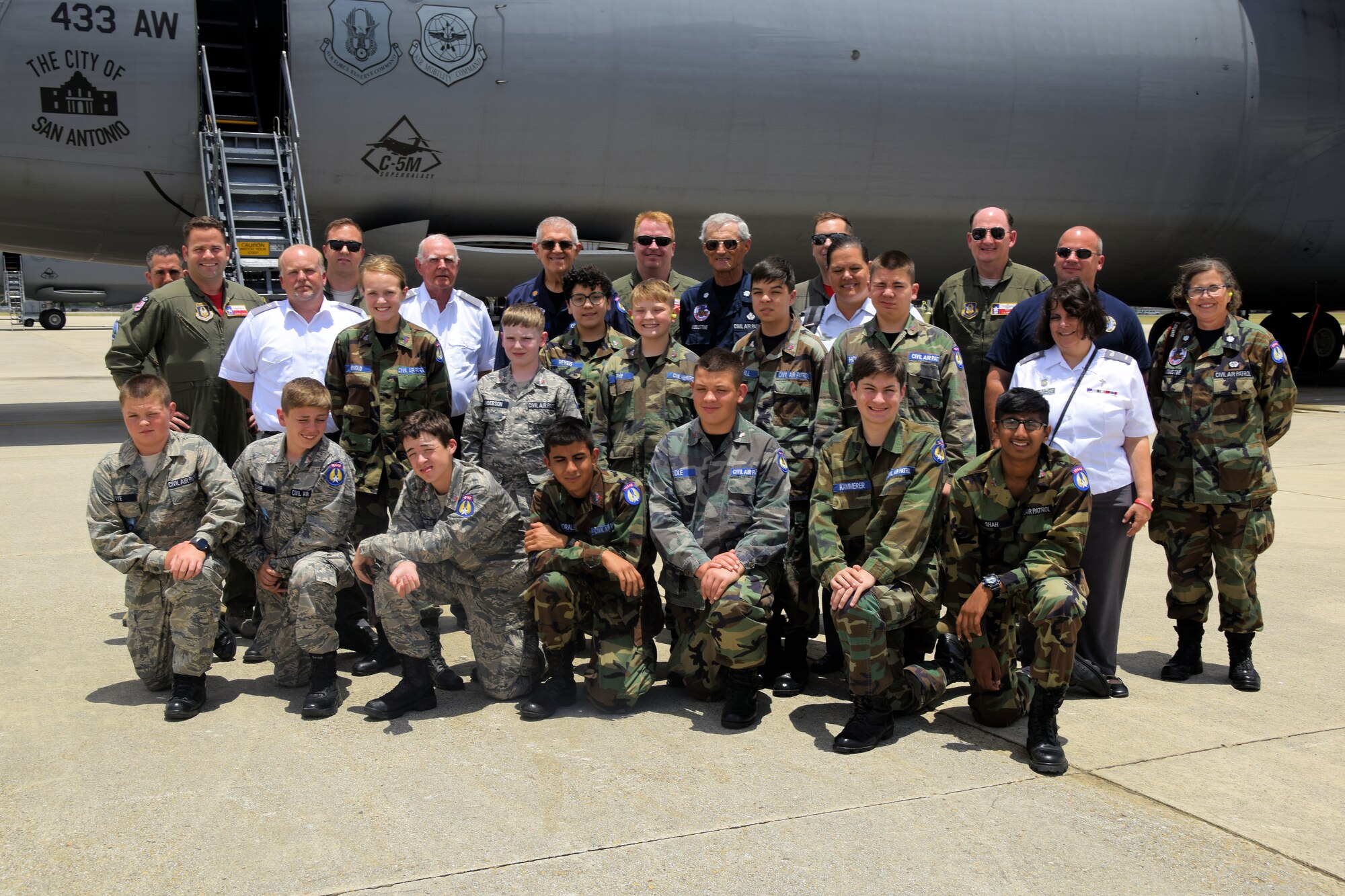 Members of the U.S. Air Force Civil Air Patrol pose with Col. Thomas K. Smith Jr., 433rd Airlift Wing commander, and members of the crew by a C-5M Super Galaxy aircraft after an incentive flight from Joint Base San Antonio-Lackland, Texas, June 8, 2018. As the official Air Force auxiliary, the CAP has approximately 57,000 volunteers and 550 aircraft assigned to more than 1,500 units stateside available or currently supporting non-combat missions on behalf of the Air Force. (U.S. Air Force photo by Staff Sgt. Lauren M. Snyder)