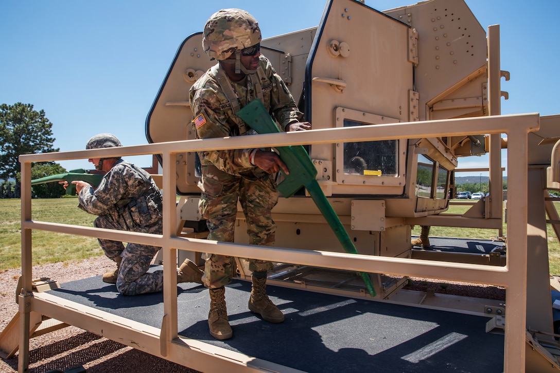 Soldiers organize the High Mobility Multipurpose Wheeled Vehicle Egress Assistance Training as part of Golden Coyote.