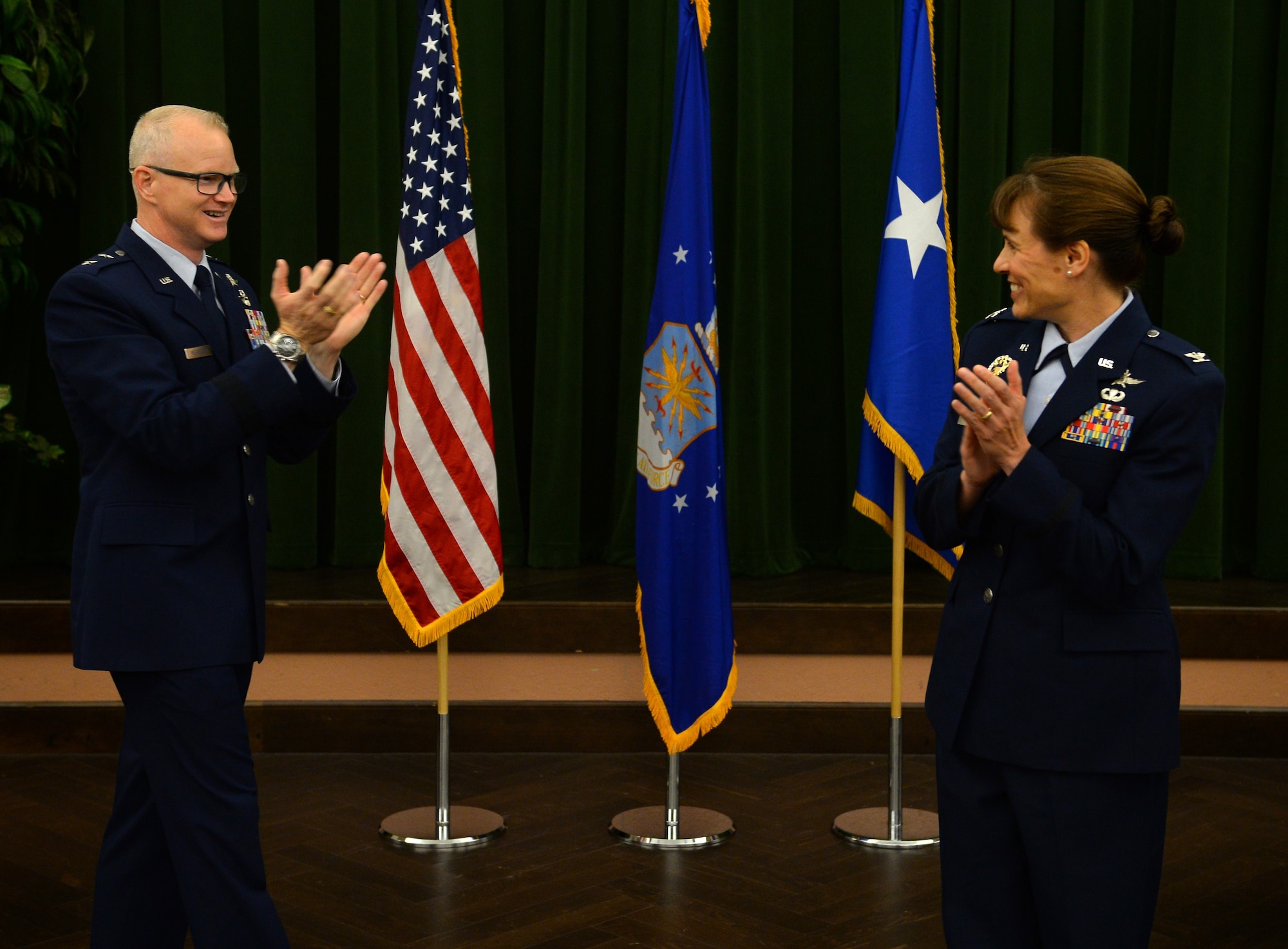 Maj. Gen. Chris Weggeman, Air Forces Cyber commander, congratulates Col. Melissa Cunningham, new 67th Cyberspace Wing commander, during the wing’s change of command ceremony at Joint Base San Antonio-Lackland, Texas, June 20, 2018. Col. Bradley Pyburn relinquished command of the wing to Cunningham. (U.S. Air Force photo by Tech. Sgt. R.J. Biermann)