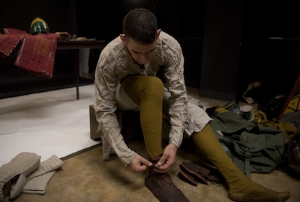 U.S. Air Force Senior Airman Benjamin Lanteigne, 628th Security Forces Squadron patrolman, tries on a shoe he created as a part of his medieval battle gear June 14, 2018.
