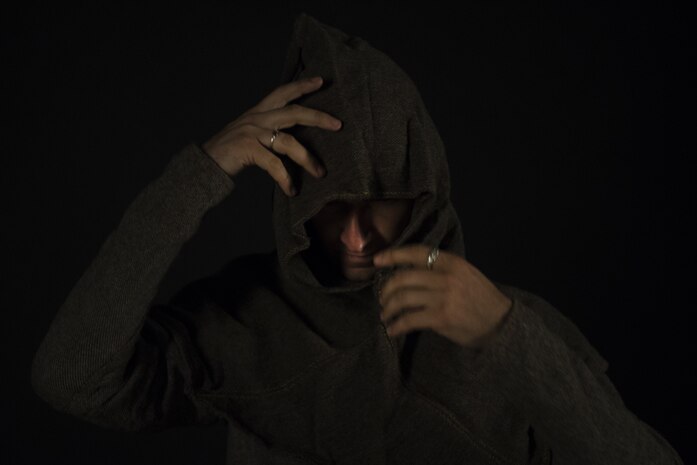U.S. Air Force Senior Airman Benjamin Lanteigne, 628th Security Forces Squadron patrolman, tries on a hood he created as a part of his medieval battle gear June 14, 2018.