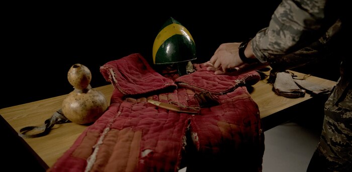 U.S. Air Force Senior Airman Benjamin Lanteigne, 628th Security Forces Squadron patrolman, lays out his war reenactment gear on a table June 14, 2018.