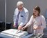 Earl Sollmann, (left) Air Force Life Cycle Management Center International Support Branch chief and Kathryn Chaney, AFLCMC logistics management specialist, make the first slice into the cake during Air Force Security Assistance and Cooperation Directorate’s 40th birthday celebration at Wright-Patterson Air Force Base, Ohio, June 14, 2018. (U.S. Air Force photo/Michelle Gigante)