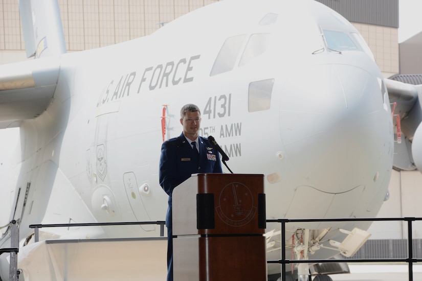 U.S. Air Force Lt. Col. E. Race Steinfort, Air Mobility Command Test and Evaluation Squadron incoming commander, makes comments during the change of command ceremony, June 8, 2018. Steinfort was joined by his wife, Air Force Maj. Emily Steinfort, and their children, along with his cousin, U.S. Navy Lt. Christian Heidgerd.