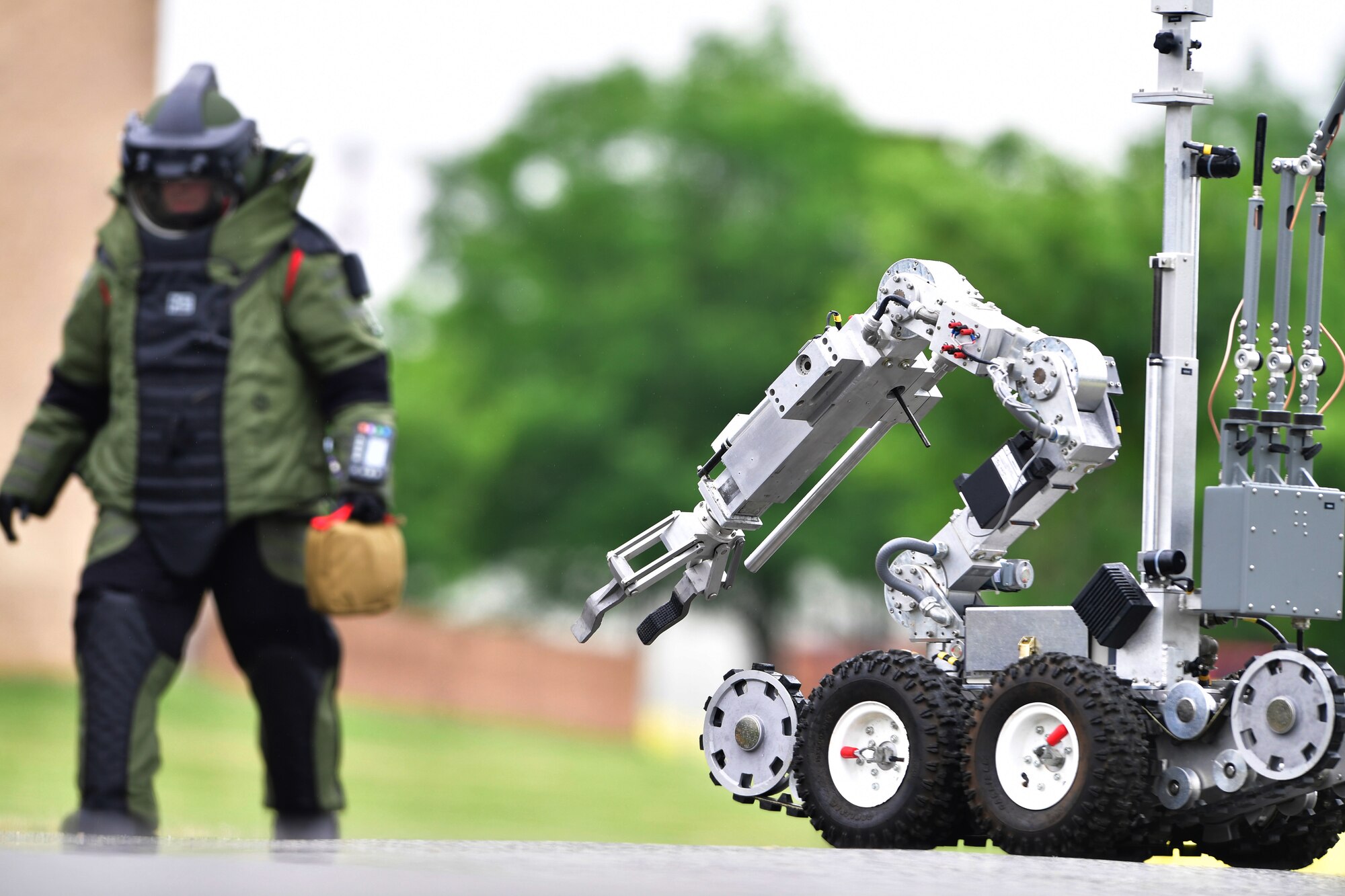 An F6 robot is used to investigate a suspicious package during a training event at New Castle Air National Guard Base, Del., June 21, 2018. The training provided an opportunity to train and execute emergency response procedures in the event a suspicious package were reported on base. (U.S. Air National Guard photo by Staff Sgt. John Michaels)