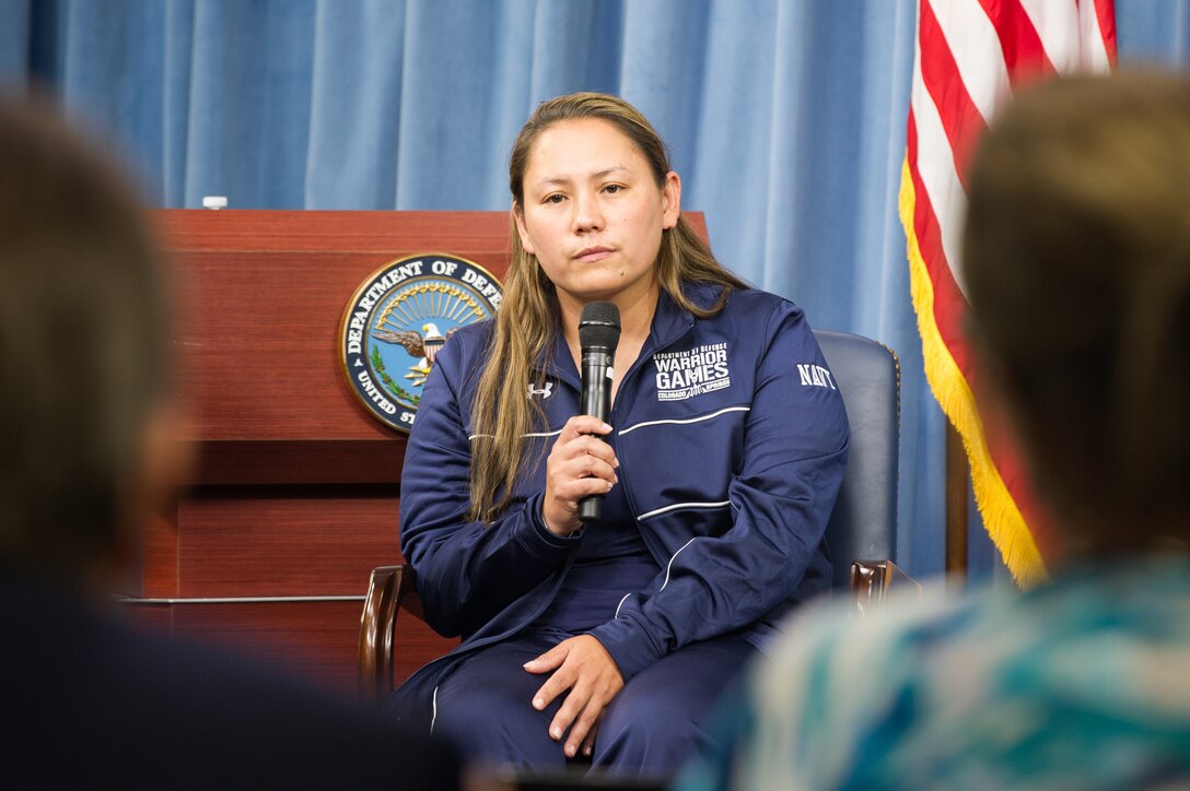 Navy Master Chief Petty Officer Reina Hockenberry addresses media at the Pentagon.
