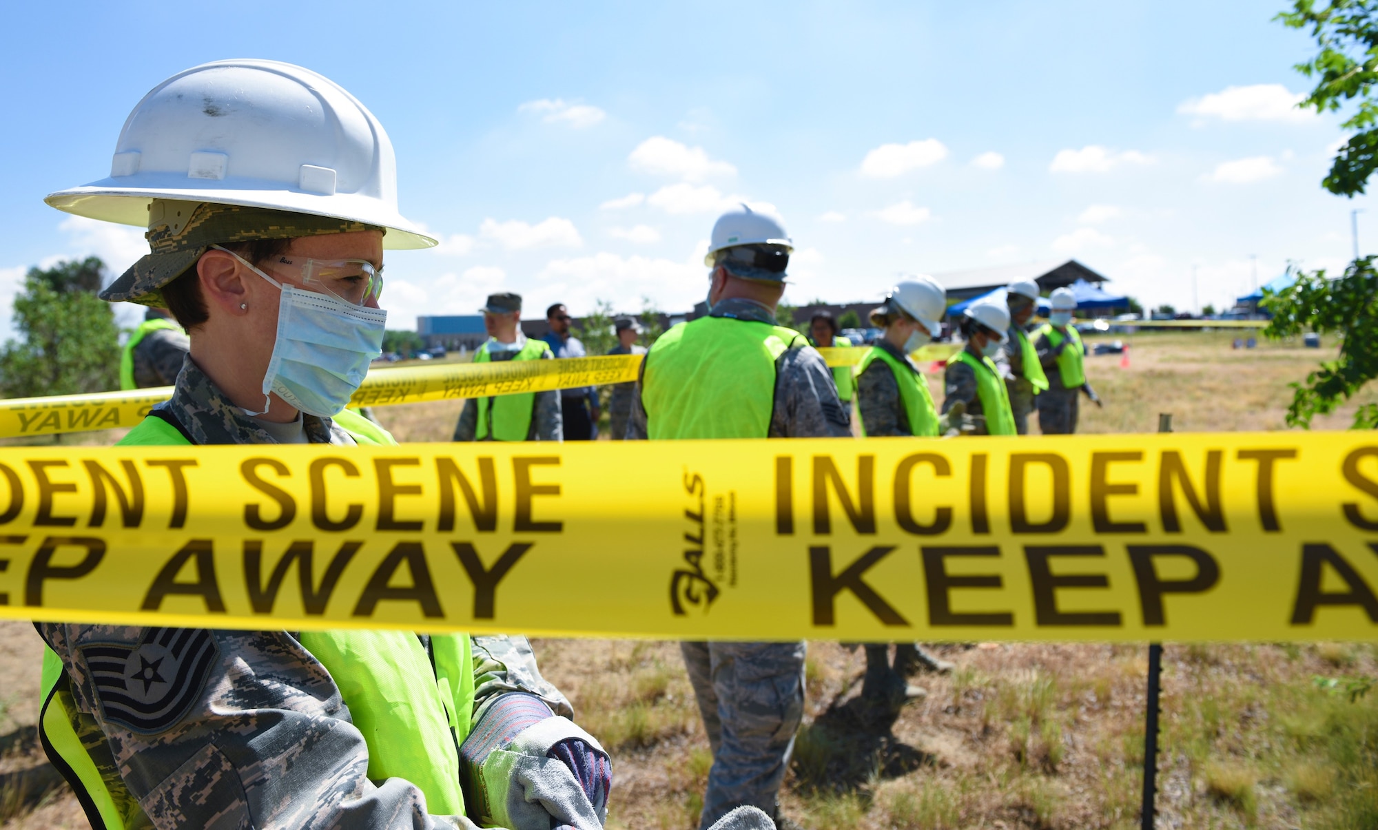 Airmen from the 460th Force Support Squadron and 103rd Special Operations FSS prepare to sweep the simulated area June 20, 2018, on Buckley Air Force Base, Colorado. The training team was required to find nearly 270 different objects in the field. (U.S. Air Force photo by Airman 1st Class Michael D. Mathews)