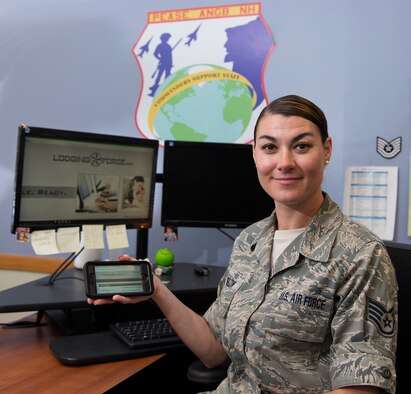 Staff Sgt. Brittany G. Bigelow, a personnelist assigned to the 157th Maintenance Group, poses for a portrait on June 19, 2018 at Pease Air National Guard Base, N.H.  Bigelow has worked to bring the Lodging Force application to the Wing, to improve the process of booking hotel accommodations for airmen who are in a duty status, saving working hours and funds. (N.H. Air National Guard photo by Staff Sgt. Kayla White)