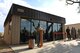 Senior Airman Brianna Finley, 56th Force Support Squadron food service journeyman, narrates the ribbon cutting ceremony for the flight kitchen expansion at Luke Air Force Base, Ariz., June 14, 2018. The expansion provides an enclosed, air-conditioned area of what used to be an outdoor patio, where maintainers and other Airmen eat during long shifts on the flightline. (U.S. Air Force photo by Senior Airman Ridge Shan)