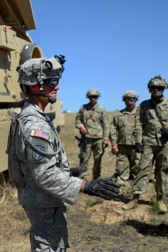 A soldier conducts a safety brief and familiarization training.