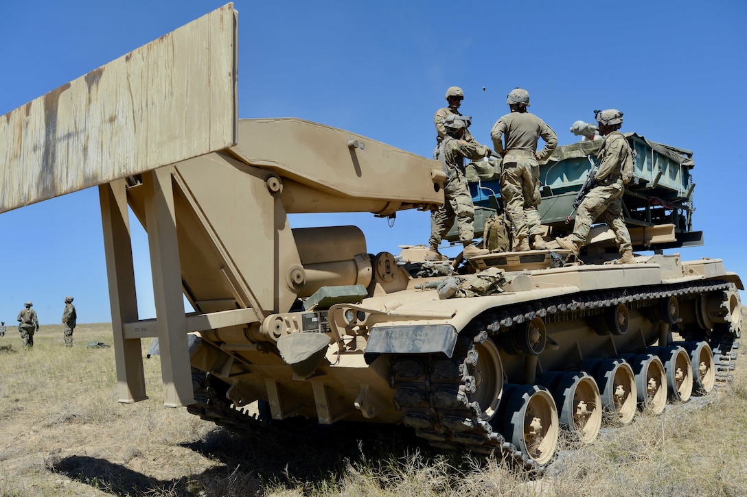 Soldiers prepare their tactical vehicle before conducting an M58 mine clearing line charge live-fire.